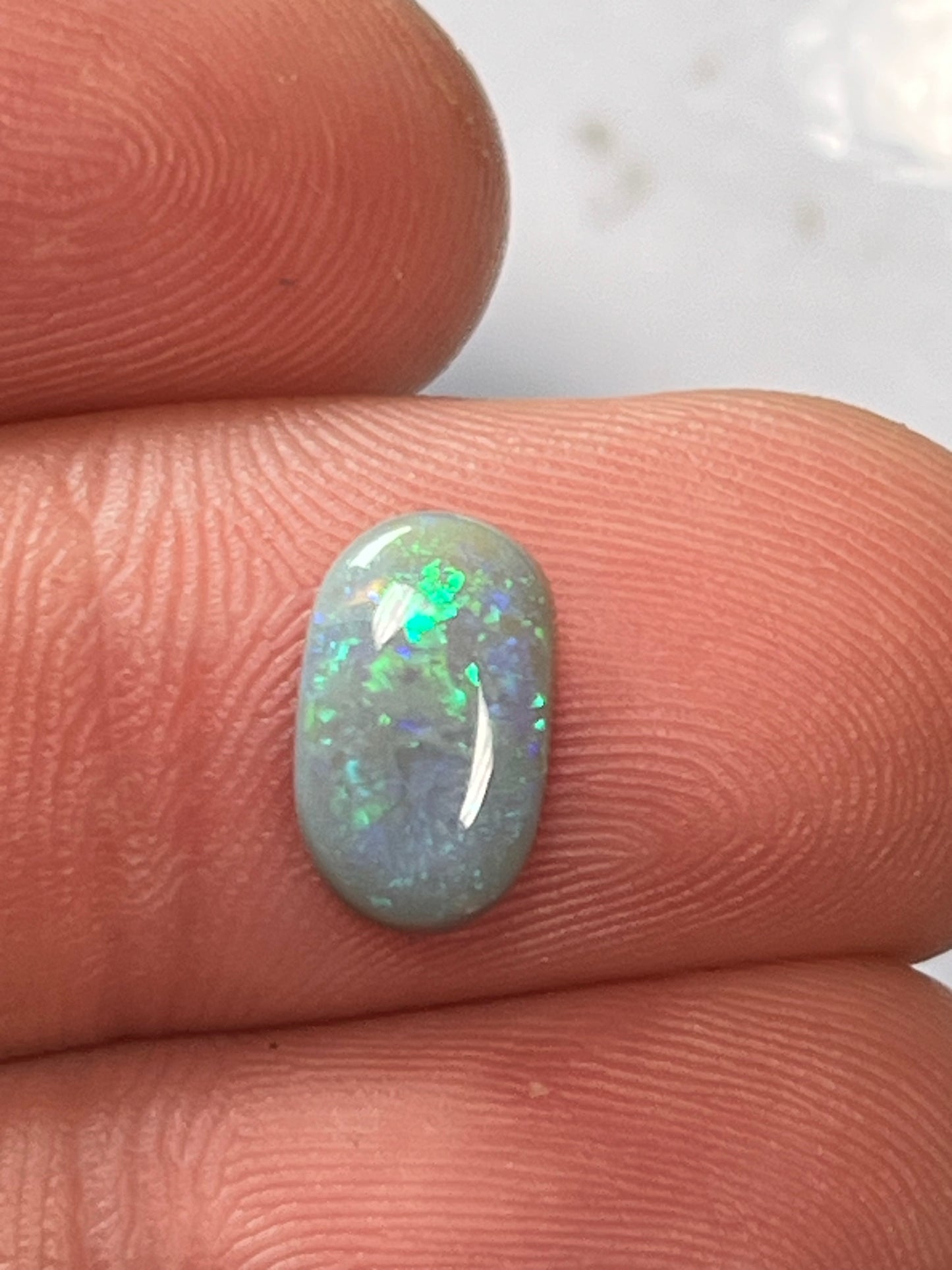 Lightning Ridge 1.60ct light grey base with blue and green flick