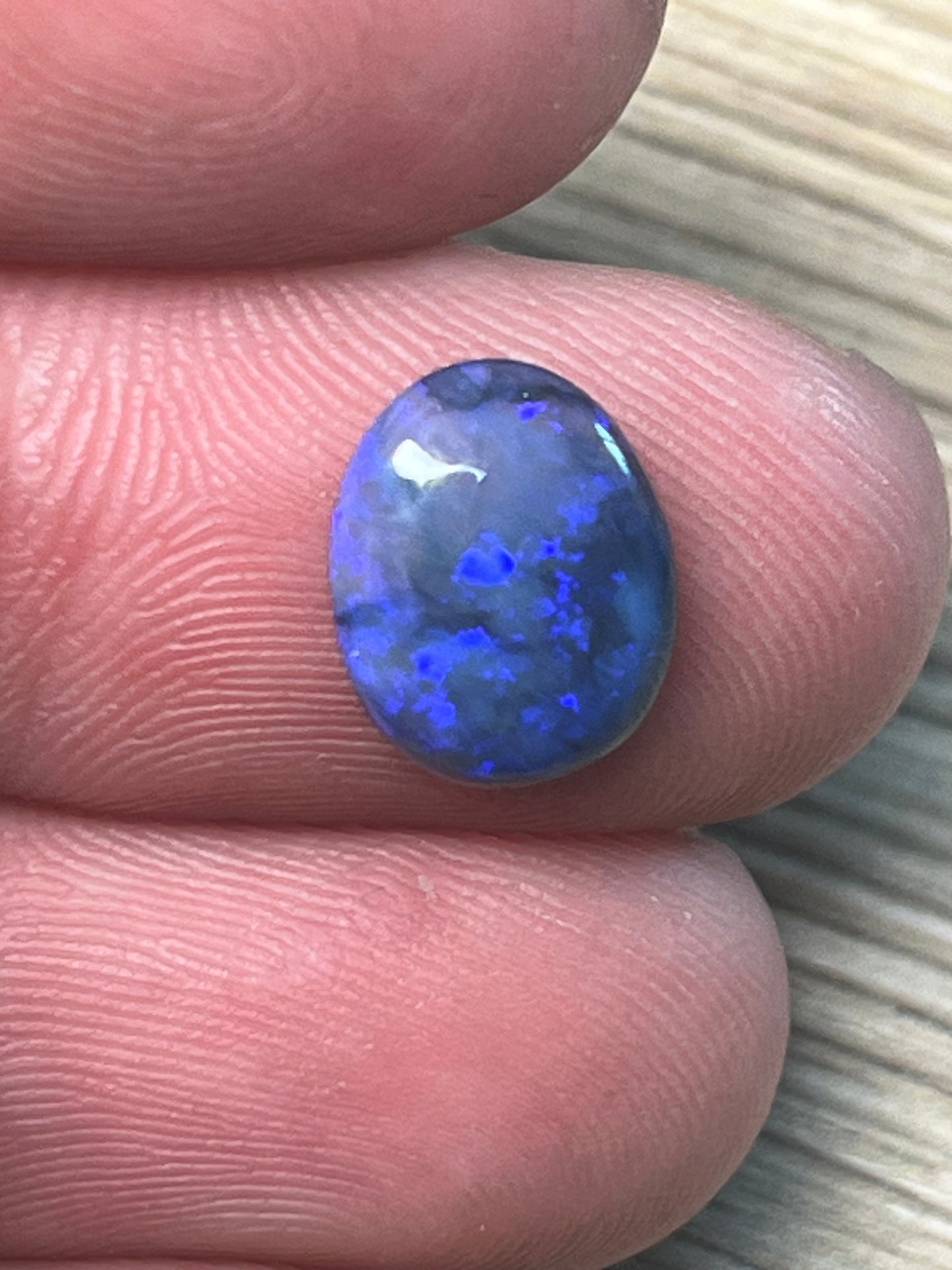 Lightning Ridge 2.10ct dark crystal with blue and purple flashes
