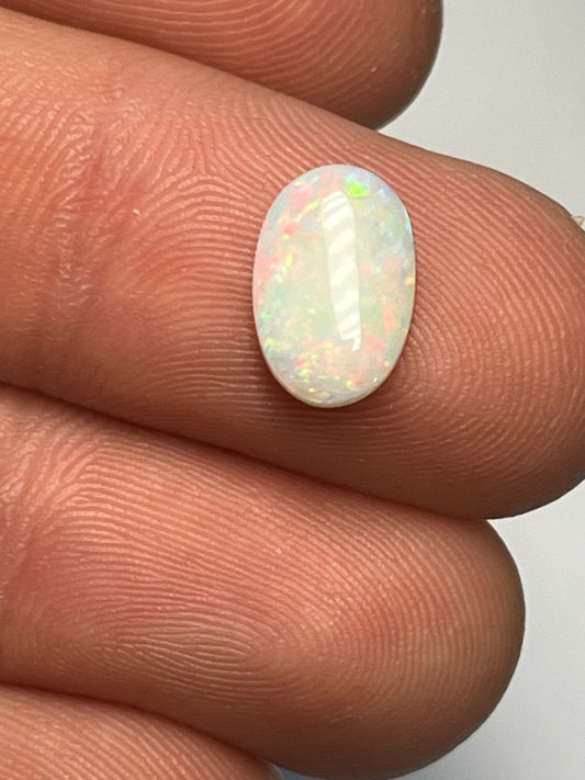 Coober Pedy 1.9ct multicolour with bright red flashes.
