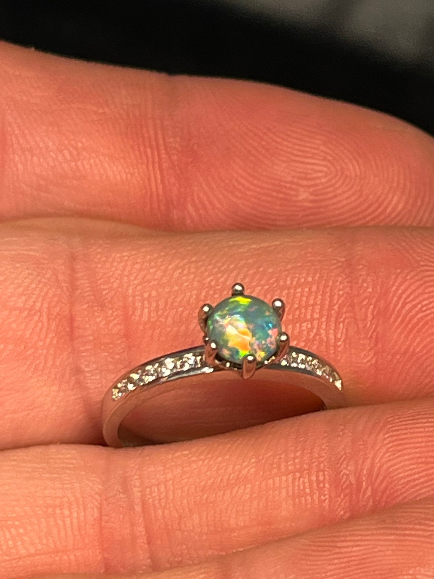Stunning lightning Ridge doublet opal set in silver with small zirconia Crystals.