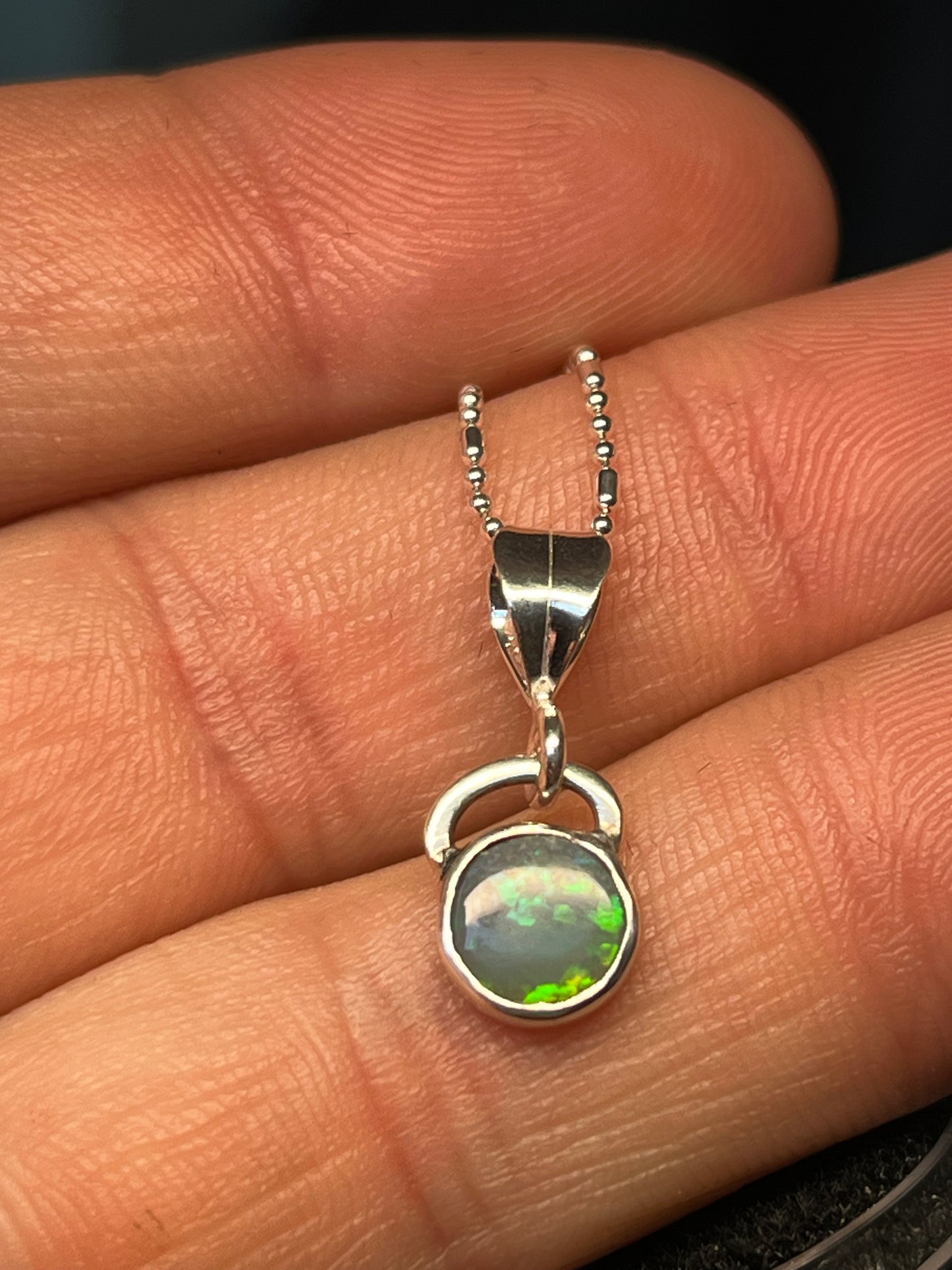 Lightning Ridge semi black Opal setting handmade silver pendant with 16 inch chain.